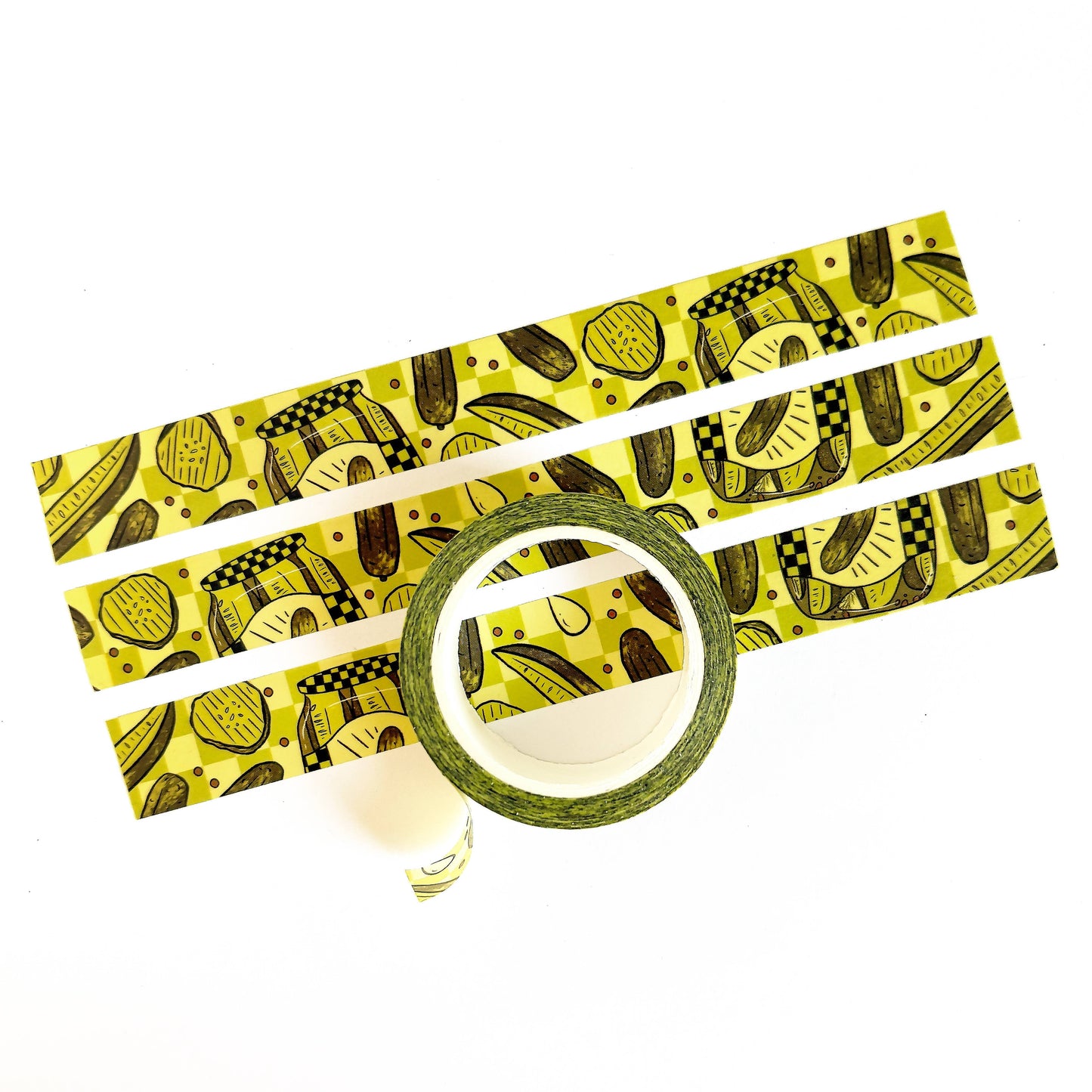 Washi tape that features a repeating pattern of pickle jars, pickle slices and spears in a green checkerboard motif