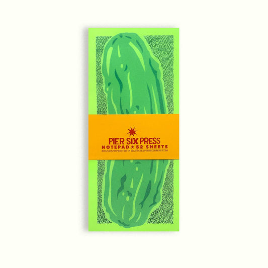 Notepad with green pickle design and Pier Six Press branding on a white background