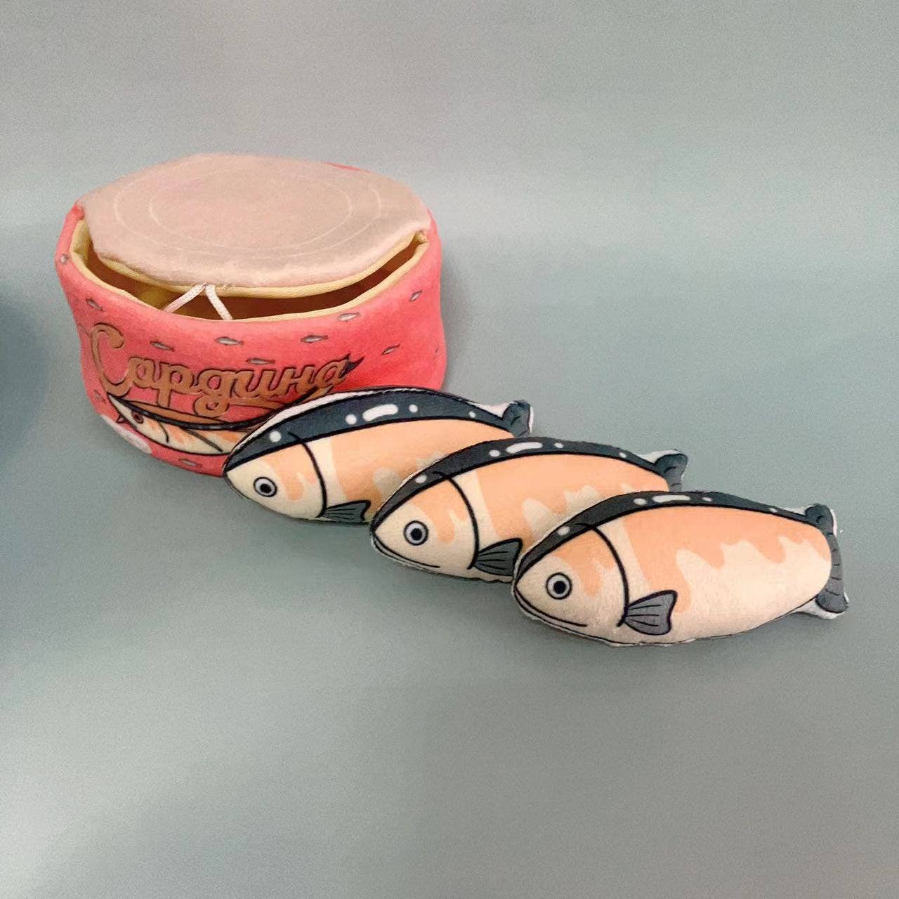 Pink fish can catnip toy with 3 individual fishes inside