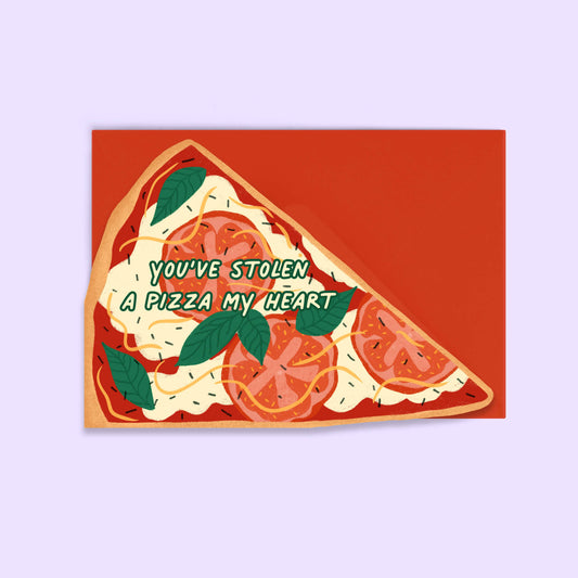 die-cut greeting card in the shape of a margherita pizza slice. Text on top reads "you've stolen a pizza my heart" 