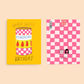 Two sides of the pomodoro greeting card -- one with a yellow card featuring a tomato can illustration and  the other with a pink and white checkered card with text.