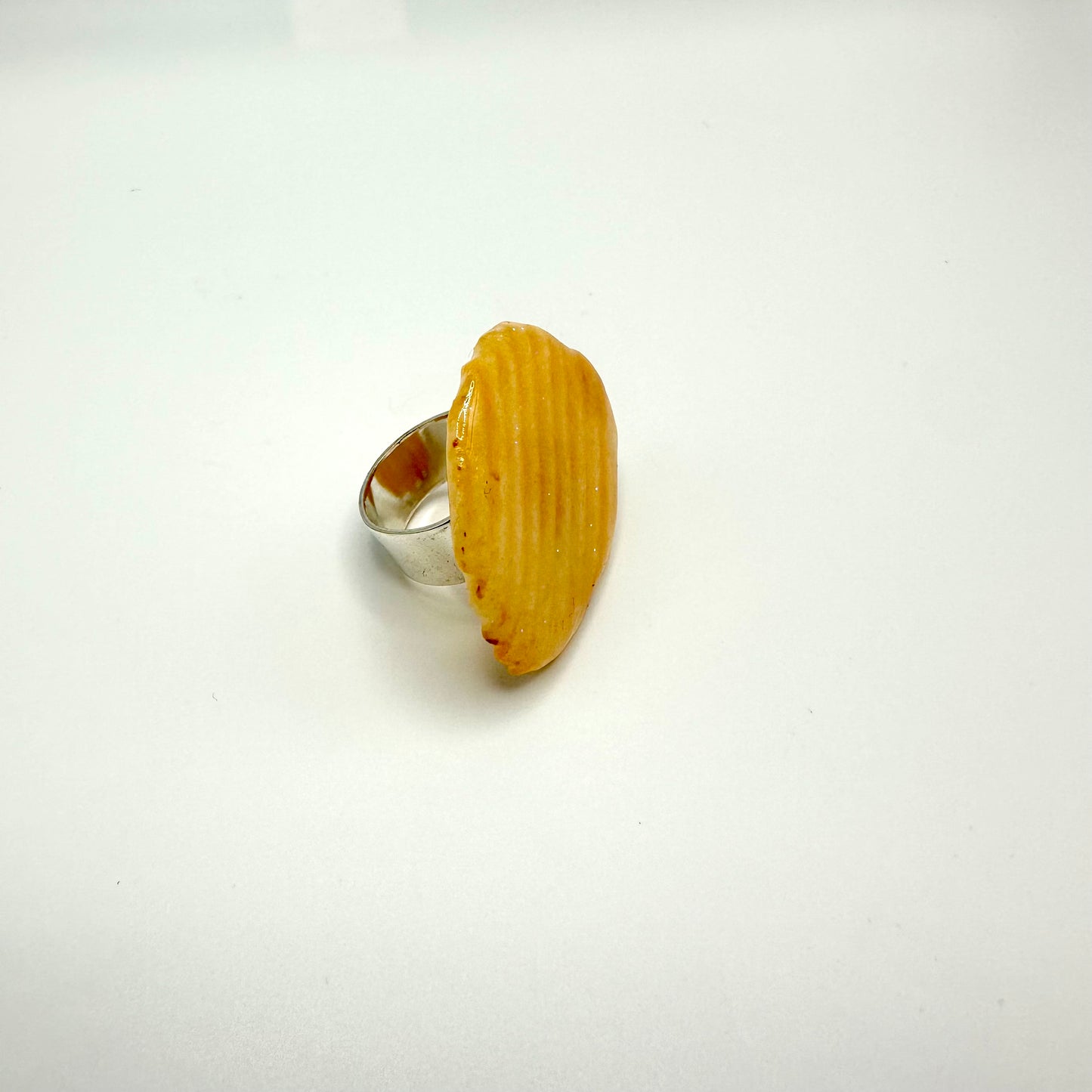 Ruffle chip ring dipped in resin.