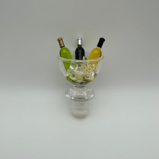 Bottle stopper designed with an acrylic wine bowl filled with ice and 3 wine bottles in it. 