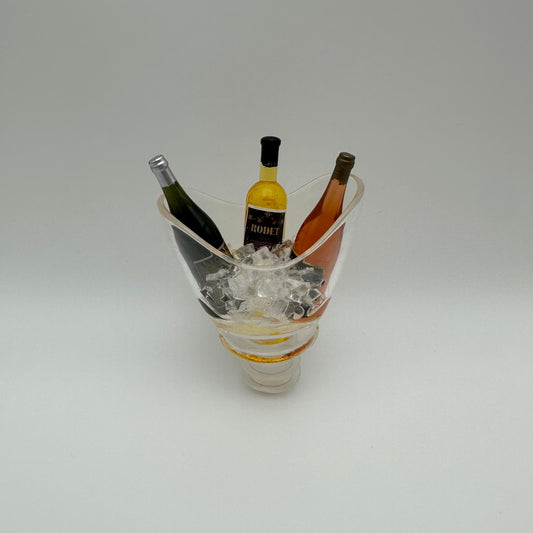 wine stopper in the shape of a gondola ice bucket filled with ice and 3 bottles of wine.