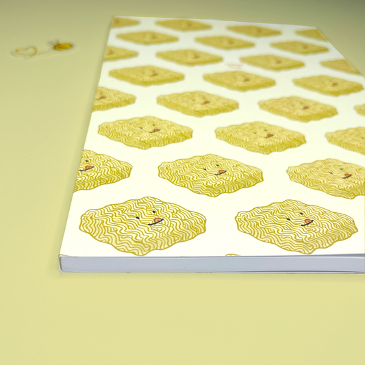Notebook with yellow noodle pattern on a light yellow background