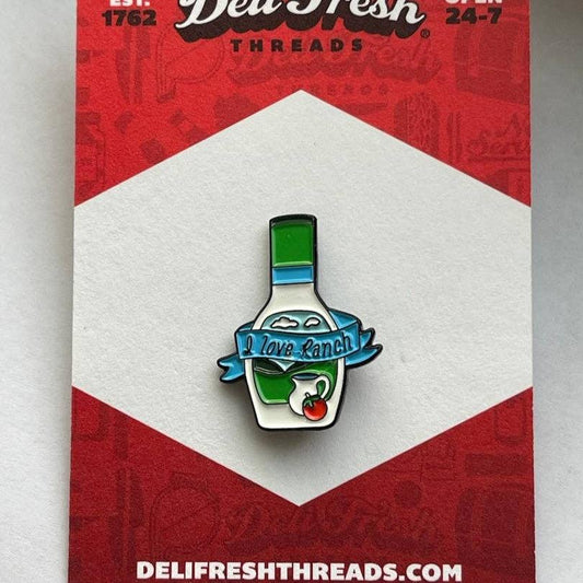 Ranch bottle lapel pin that has a ribbon across the bottle that says "I love Ranch". on a card backing that reads Deli Fresh.