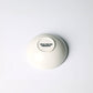 White ceramic bowl with a visible brand logo on a white background