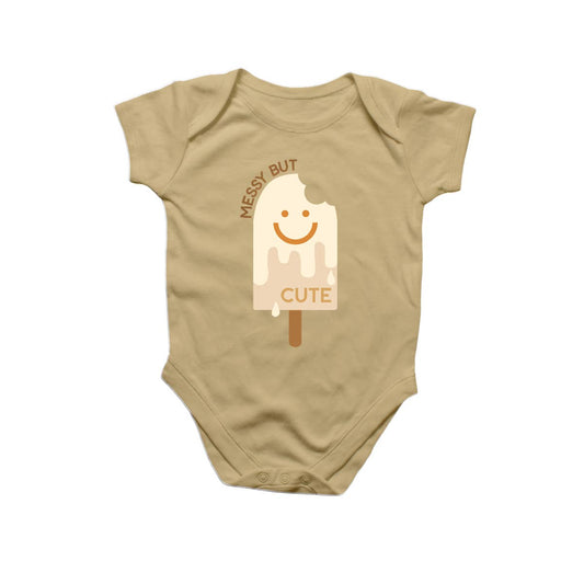 baby onesie with a bitten/melting popsicle design. Text reads "Messy but Cute" 
