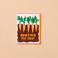 Greeting card with carrots and text 'Rooting for you!' on a beige background