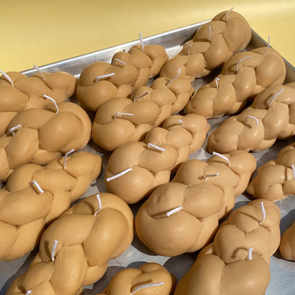 A sheet pan full of challah bread.