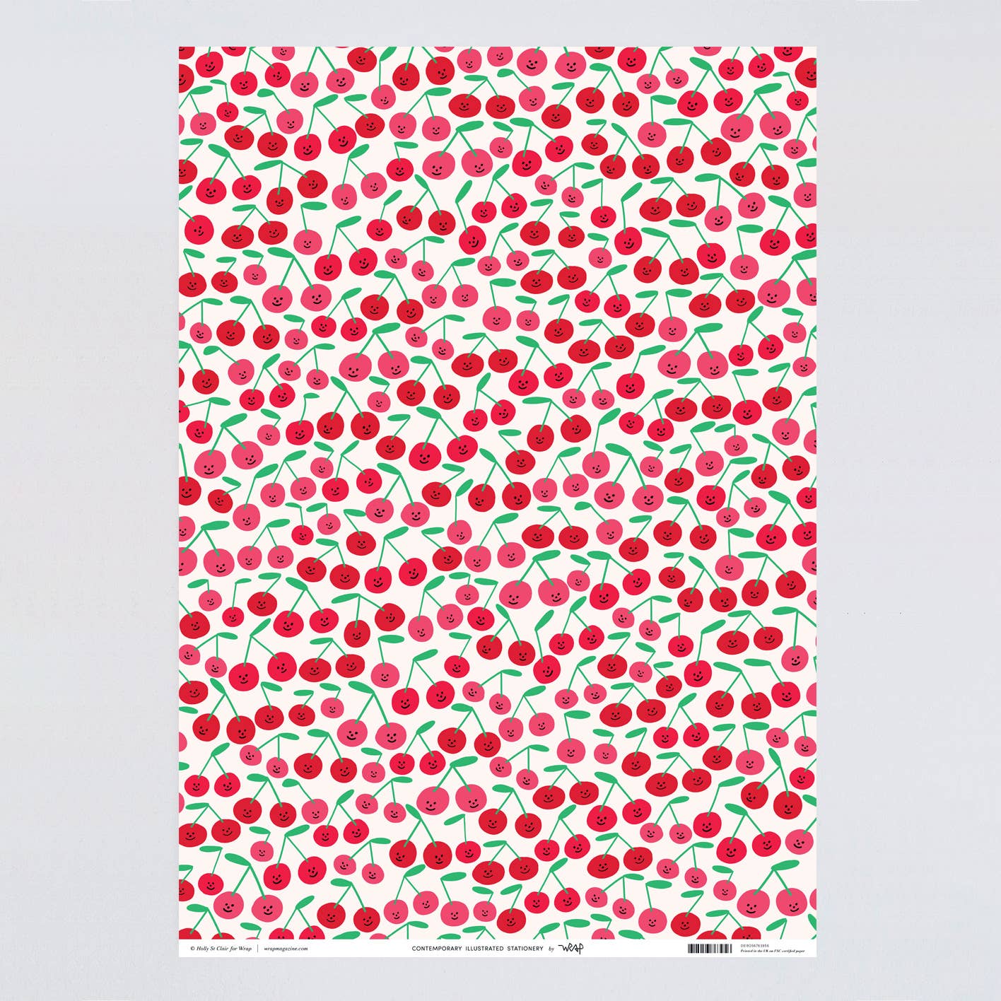 Gift wrap sheet with a smiley-faced cherry design all over 