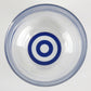 Close up photo of two concentric blue circles (bullseye pattern) on the bottom of the glass.