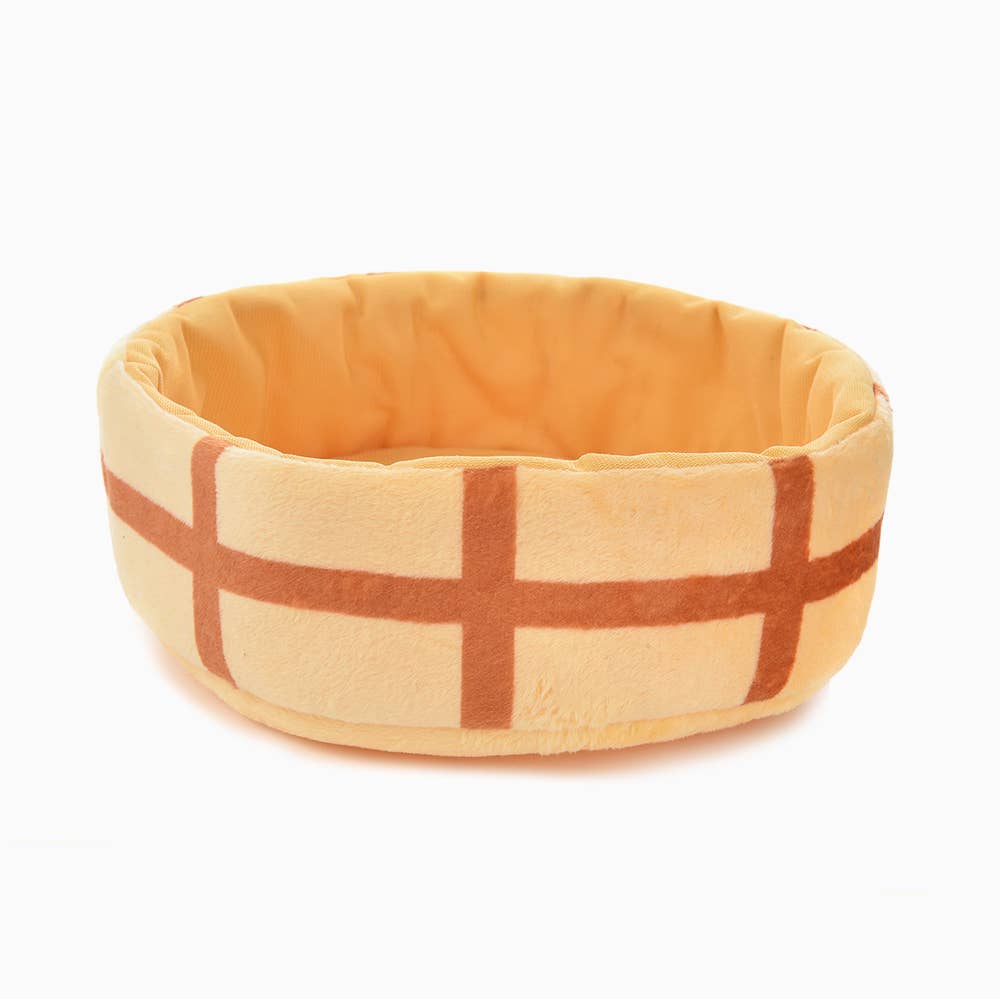 Round plush steamer basket dog toy with plaid pattern on a white background