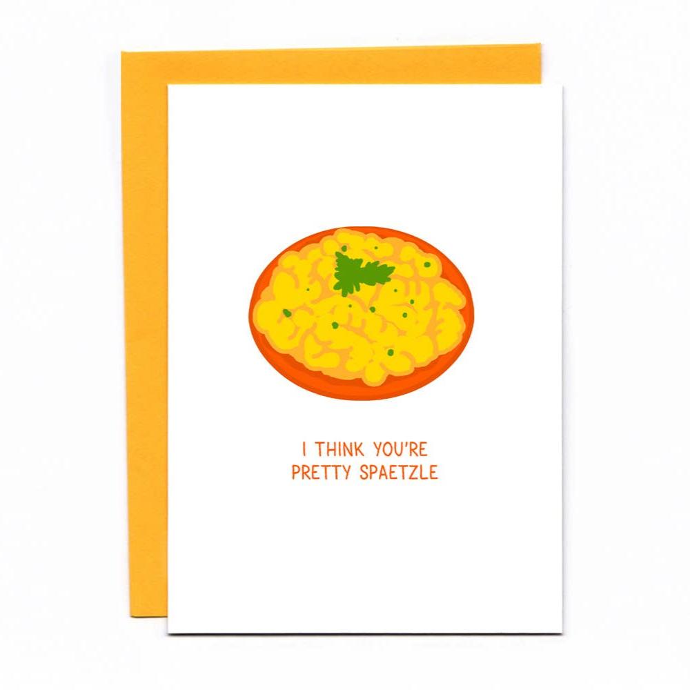 Punny card with a bowl of spaetzle in the center. The words read: I think you're pretty spaetzle. Orange envelope behind.