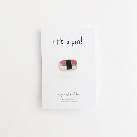 Spam musubi pin on a card with 'it's a pin!' text on a white background