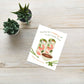 Greeting card with food illustration on a wooden surface with small plants.