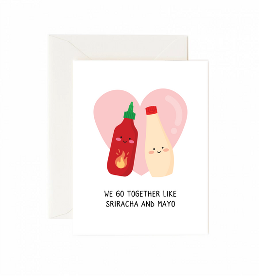 Card with cartoon sriracha and mayonnaise bottles on a heart-shaped background with text 'We go together like Sriracha and Mayo'.