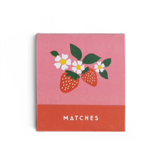 Matchbook with strawberry and flower design on a pink background