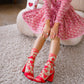 Pink and red strawberry patterned sheer crew socks on  model 