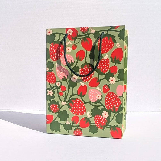 Gift bag with strawberry pattern on a white background