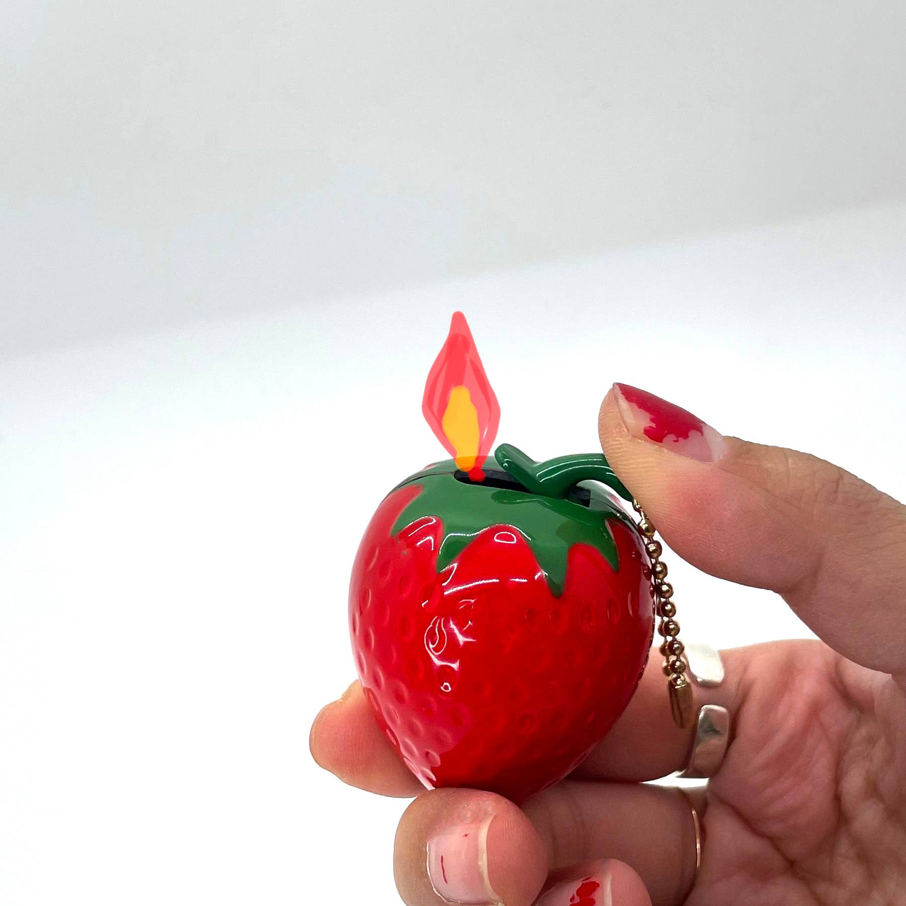image showcasing how the strawberry lighter operates 