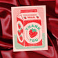 Card with strawberry milk design and 'Thank You' text on a red fabric background