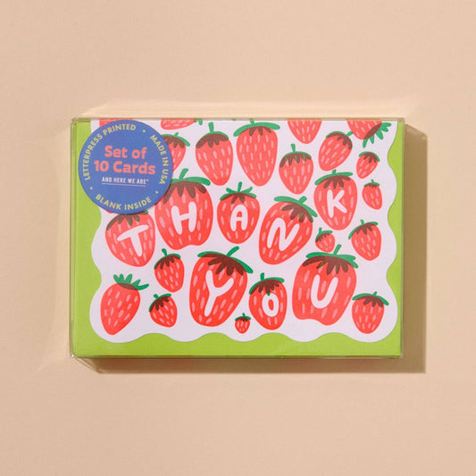 Box of strawberry-themed thank you cards on a beige background