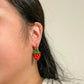 mini strawberry dangle earrings for scale 