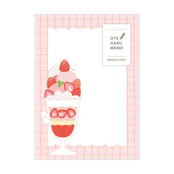 Notepad comes with 10 pages of each of the five designs for a total of 50 pages. The pad is lightly gummed at the top, which allows you to tear away any page without disrupting the other pages. Each pad is 75mm wide by 105mm tall. Designs have a white bunny rabbit hiding amongst various strawberry desserts/sweets, including a strawberry parfait pictured here. 