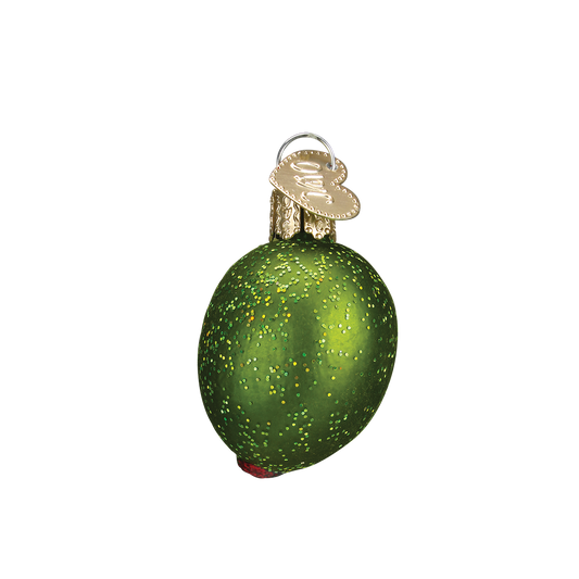 Green glittery stuffed olive Christmas ornament hanging on white background 
