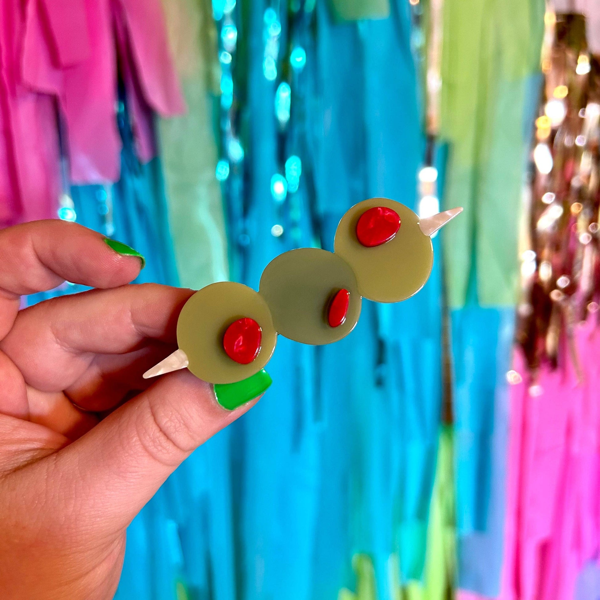 close up image of the stuffed olive hair clip 