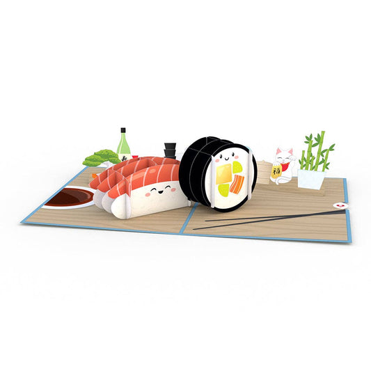 pop up greeting card featuring a piece of nigiri and maki sushi, lucky cat, bamboo, bonsai tree, soy sauce and sake. 