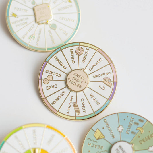 Three circular enamel pin badges arranged on a white background, with the center pin reading 'Sweet Treat + Picker' and the others partially visible around the edges.