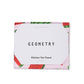 Pink weave towel with watermelon pattern. Paper band around the towel that reads "Geometry- Kitchen Tea Towel"