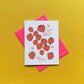 Greeting card -- mostly white with red strawberries and pink flowers all over. text reads "Knowing you makes life sweeter. Happy birthday!" 