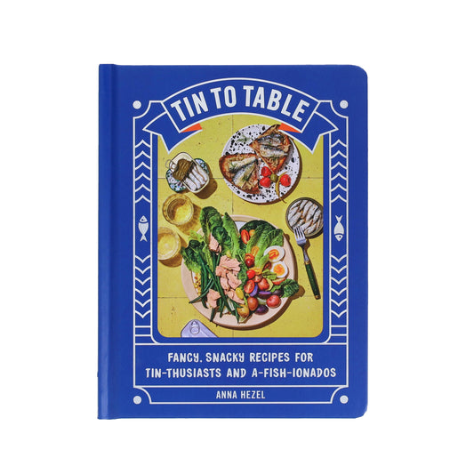 Book titled 'Tin to Table' with food illustrations on a blue background