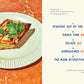 Slice of bread with tinned fish on a white plate with a book page showing chapter titles on an orange background
