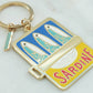 Keychain with sardine can design on a white background