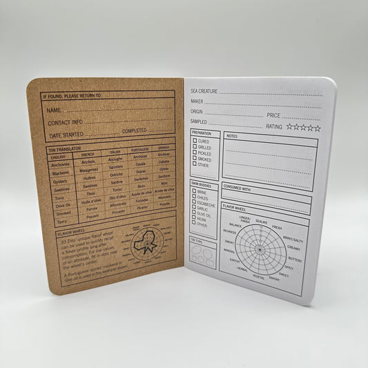 Interior of Tinned Fish Journal with a tin translator graph, flavor wheel, and pages to write notes.