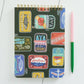 small, spiral, lined notebook with a hand painted tinned fish design 