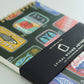 small, spiral, lined notebook with a hand painted tinned fish design 
