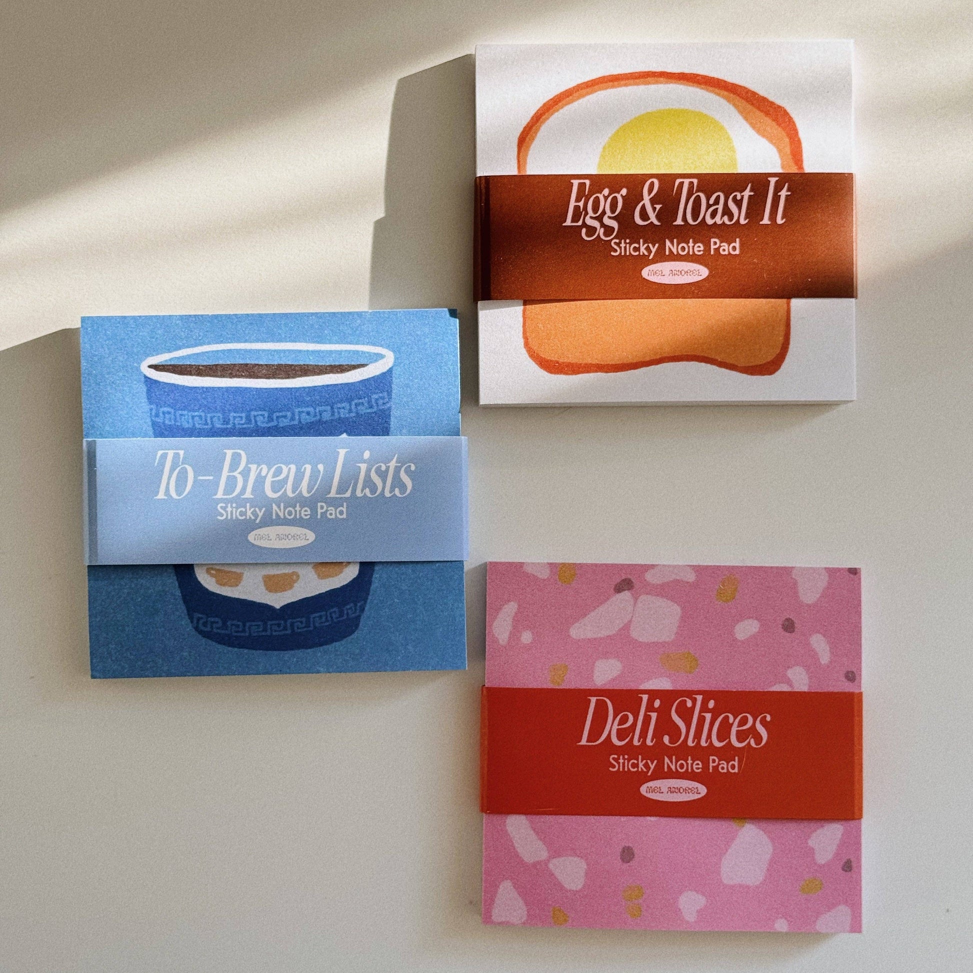 two new designs of sticky notes -- to brew lists and deli slices -- pictured with an original, egg & toast it (notes)