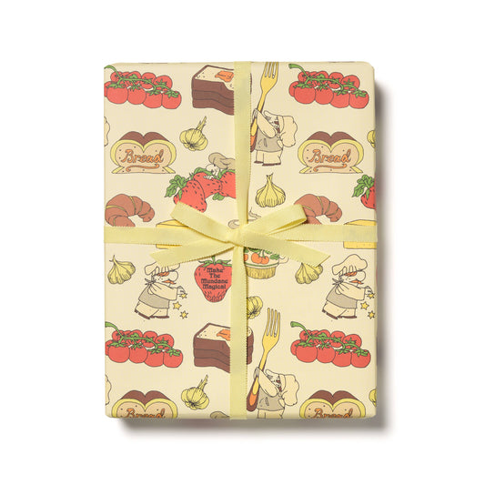 Gift box with food-themed wrapping paper featuring illustrations of tomatoes, bread, and chefs.