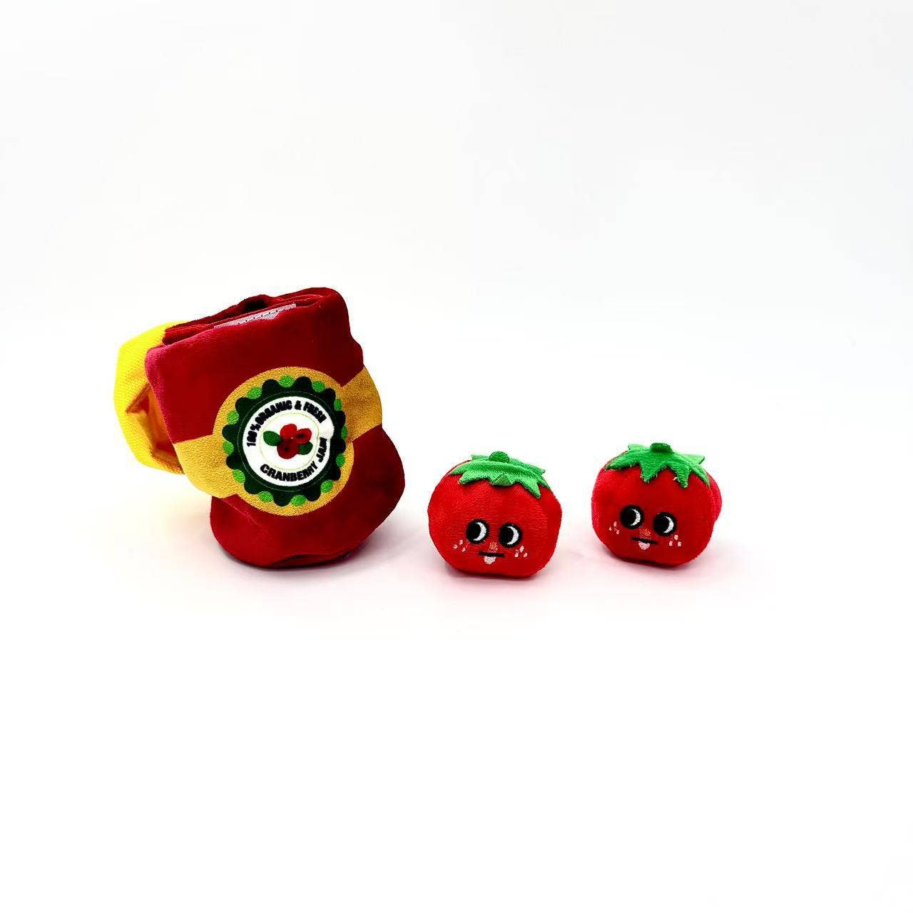 soft, plush dog toy that looks like a can of tomatoes and has 2 individual tomatoes that come out of can 