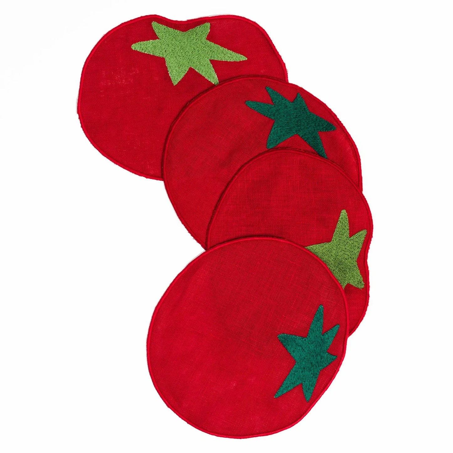 Red tomato shaped coasters on a white background