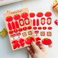 Sticker sheet with tomato and ketchup designs held by a hand on a white background