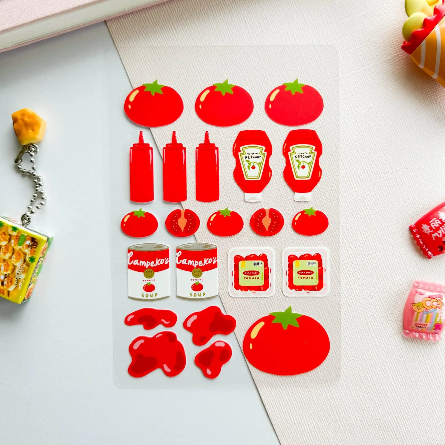 Set of red tomato-themed stickers on a white surface