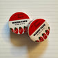 Two rolls of washi tape with tomato design on a lined paper background