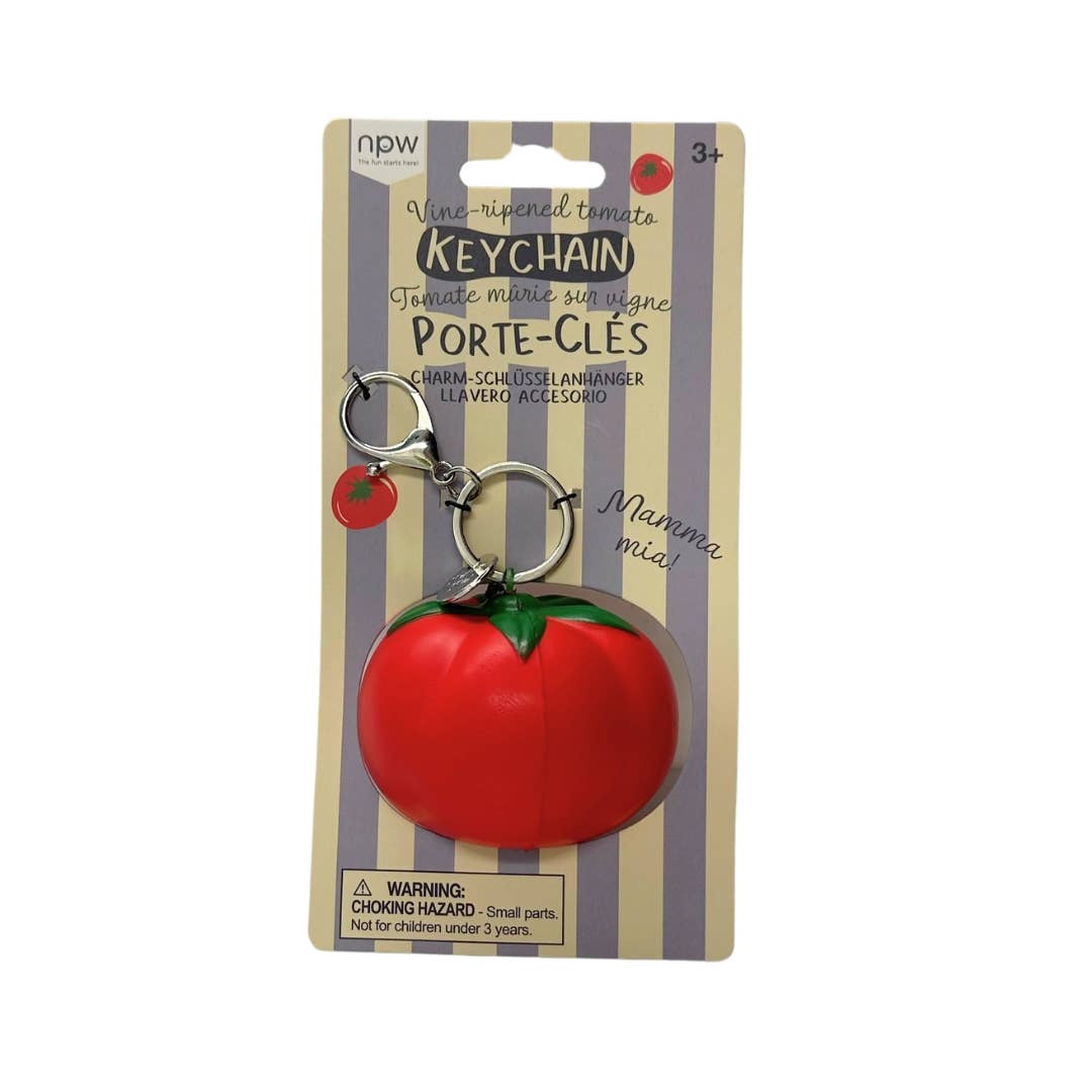 Red tomato stress ball keychain on a striped packaging with 'npw' branding.