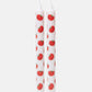 White taper candles with red tomato pattern on a white background